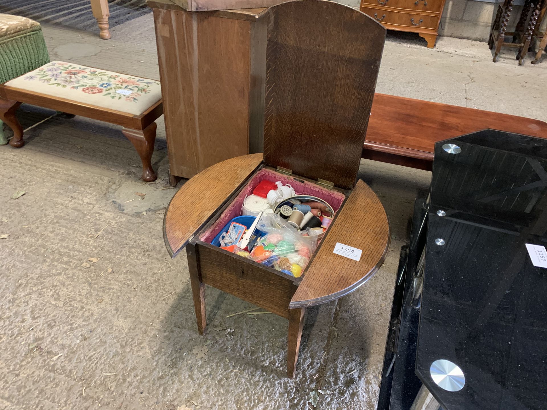 Sewing box in the form of a coffee table full of sewing items