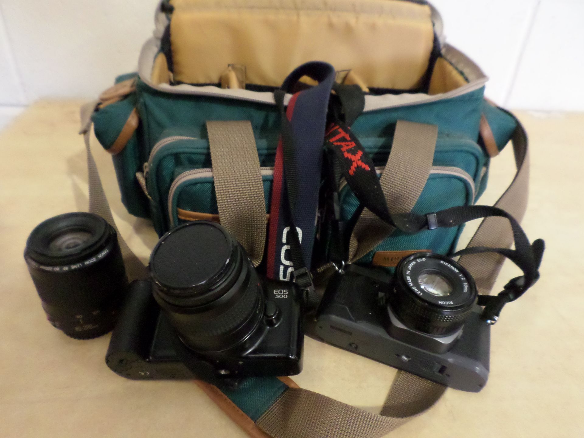 Canon Pentax cameras in carrying case with extra lenses, good condition
