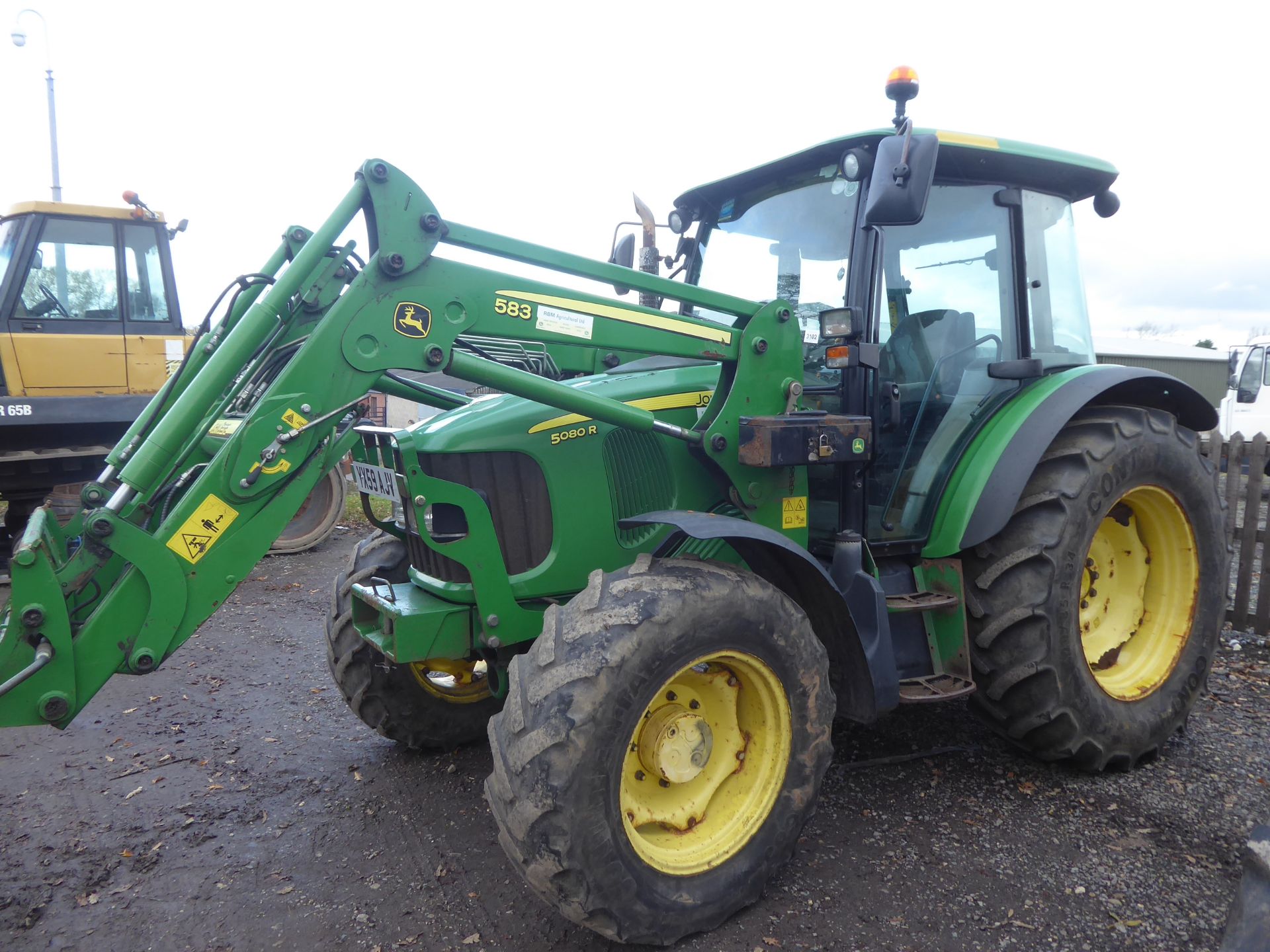 John Deere 5080R tractor with loader, 10959 hours, YX59 AJV, good condition. Loader has oil leak