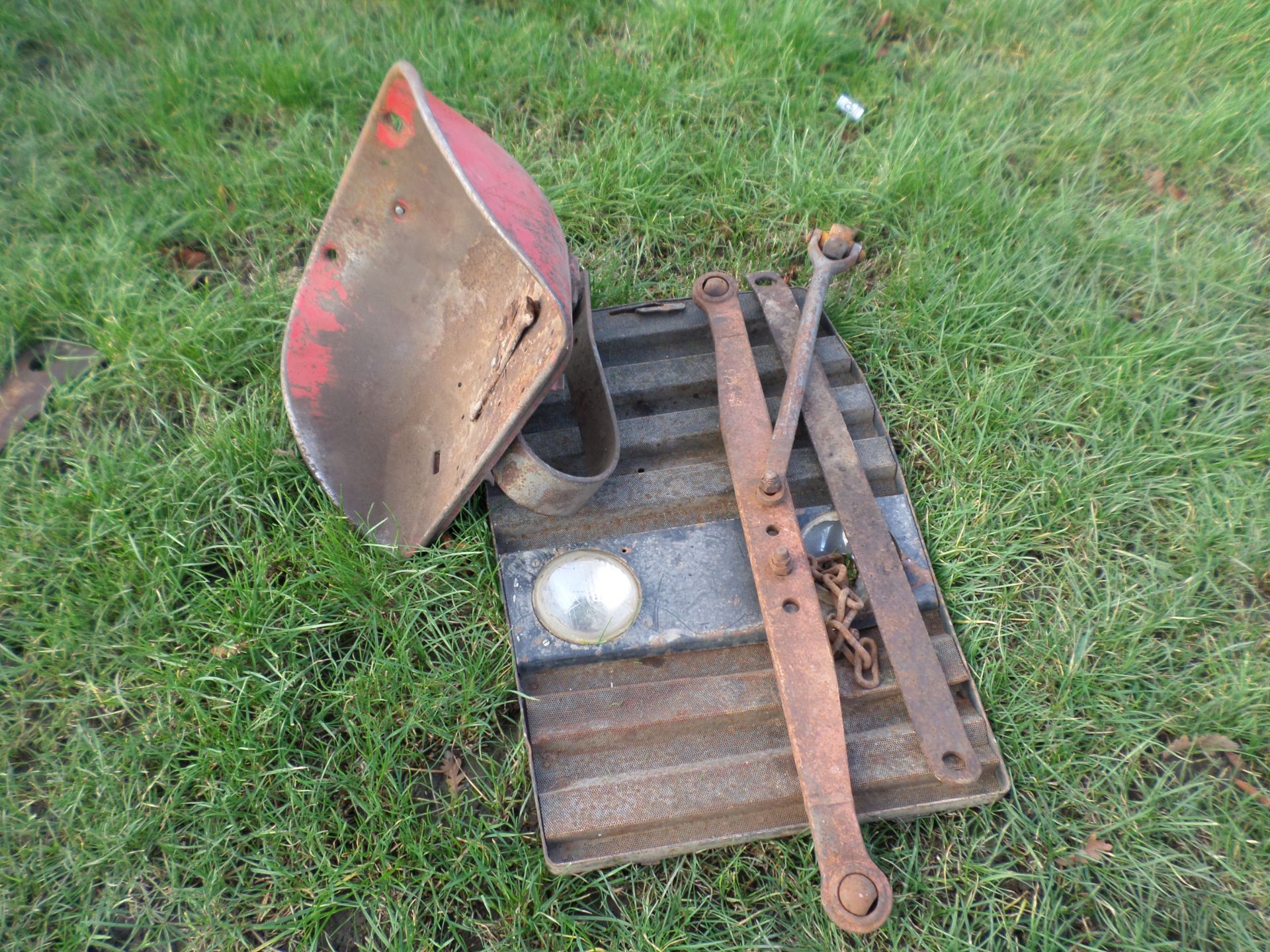 Tractor seat and front grill