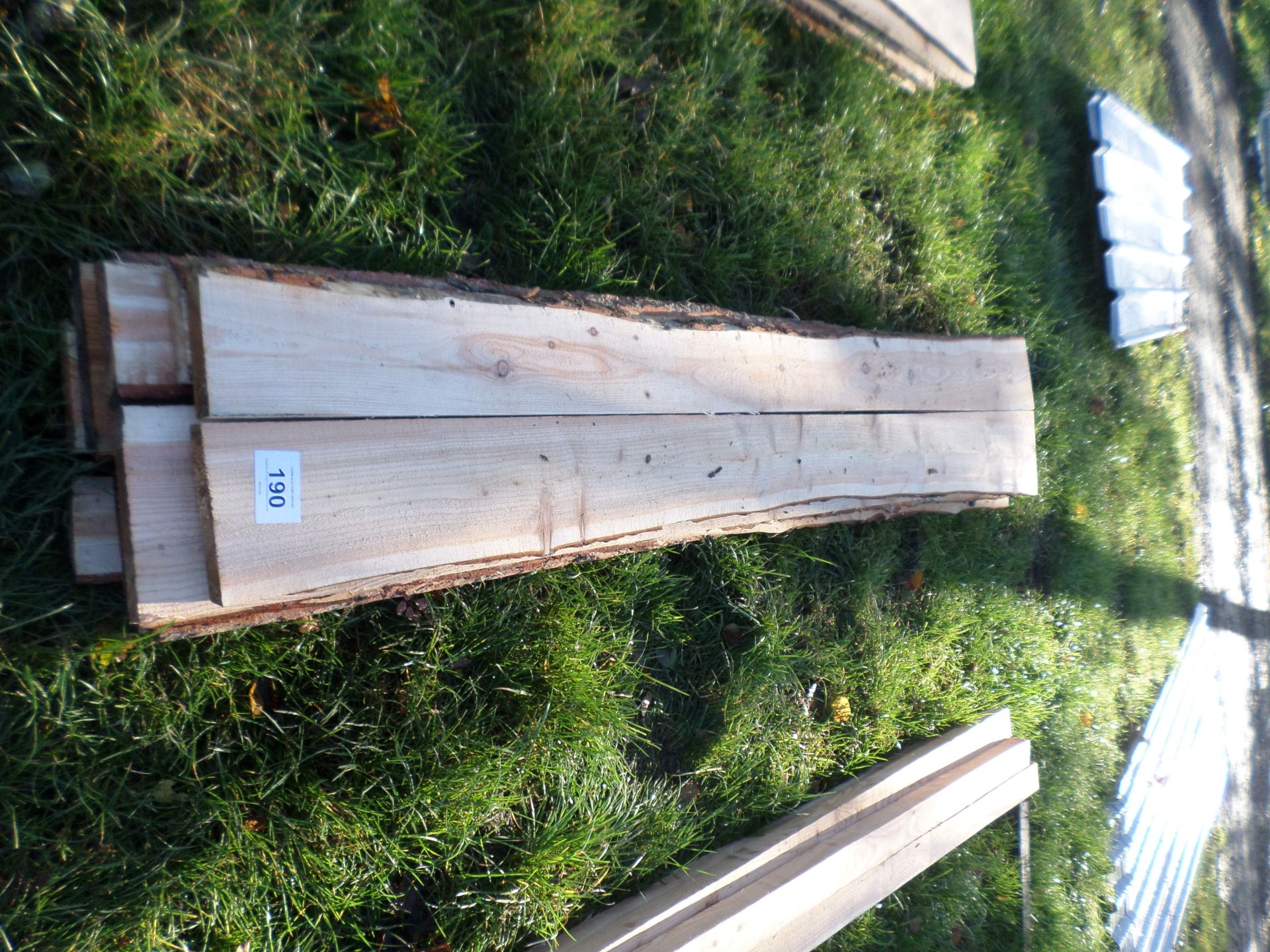 Quantity of rough cut softwood boards