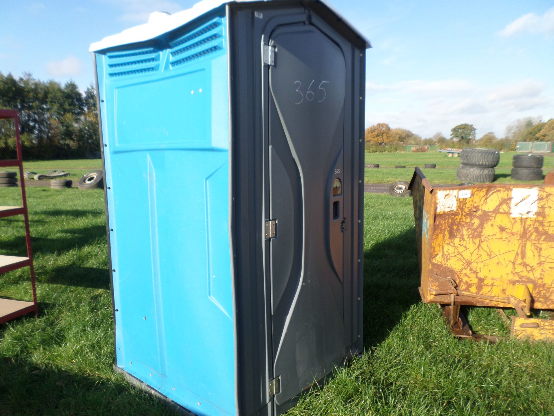 Blue mobile toilet, has been cleaned and ready to use