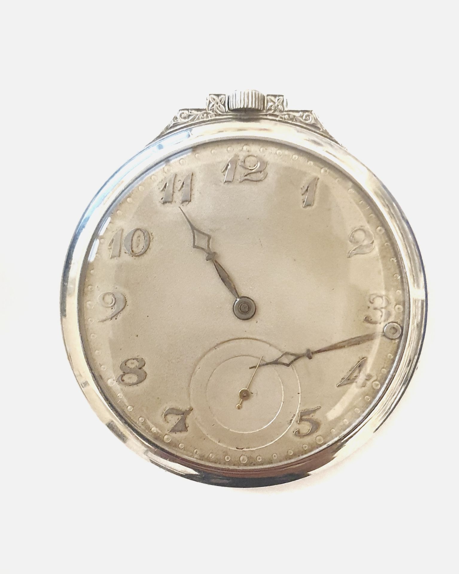 ANONYMOUSPlatinum pocket watch with diamondsEarly 20th centuryManual wind movementSilvered dial with