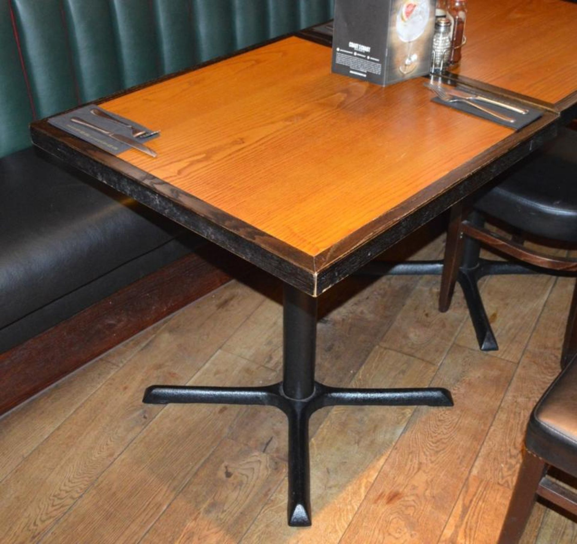 12 x Restaurant Dining Tables With Cast Iron Bases - Two Tone Wooden Finish With Shaped or Curved