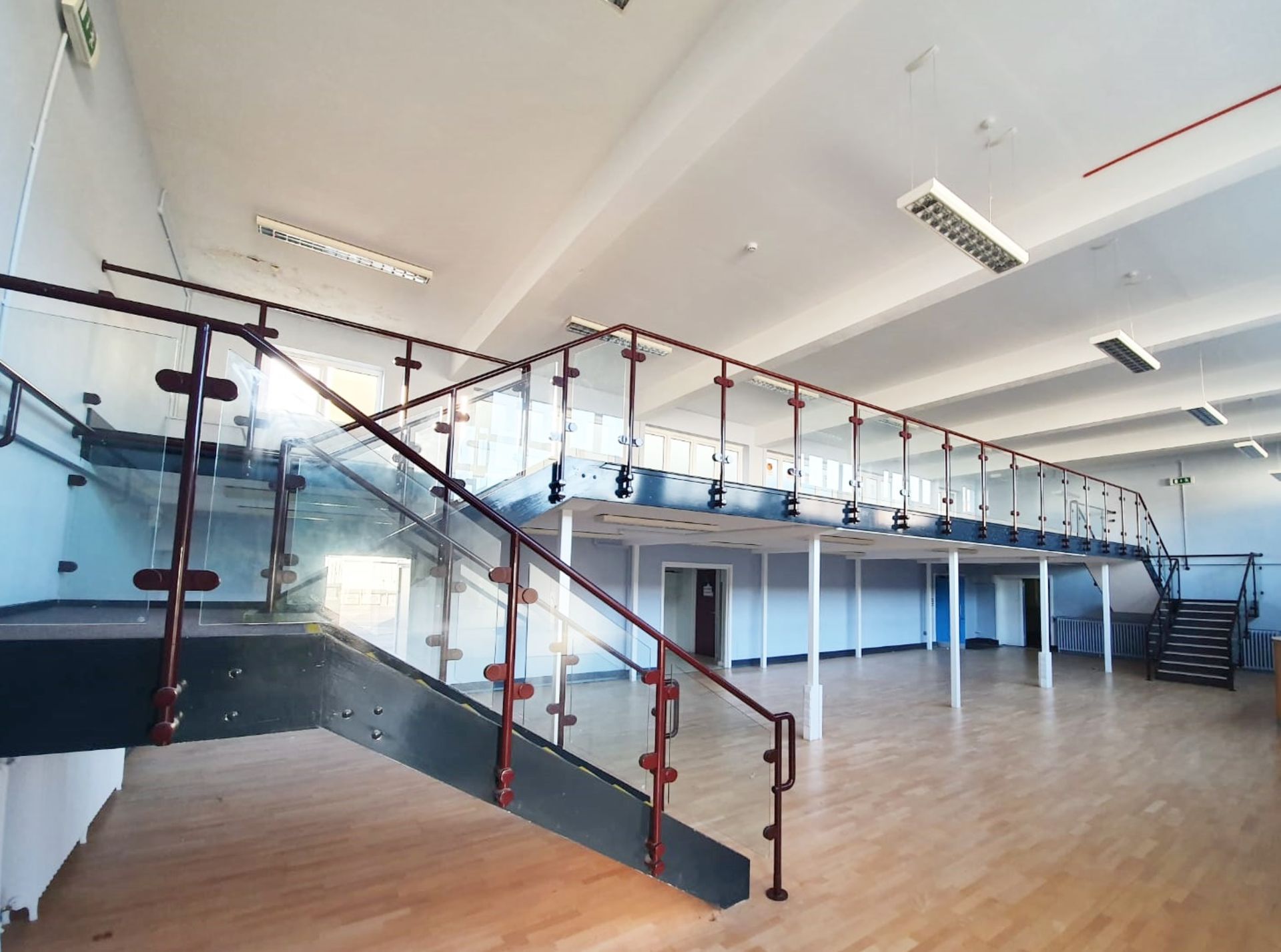 1 x Mezzanine Floor With Two Sets of Floating Stairs and Glazed Safety Panels With Hand Rails - From