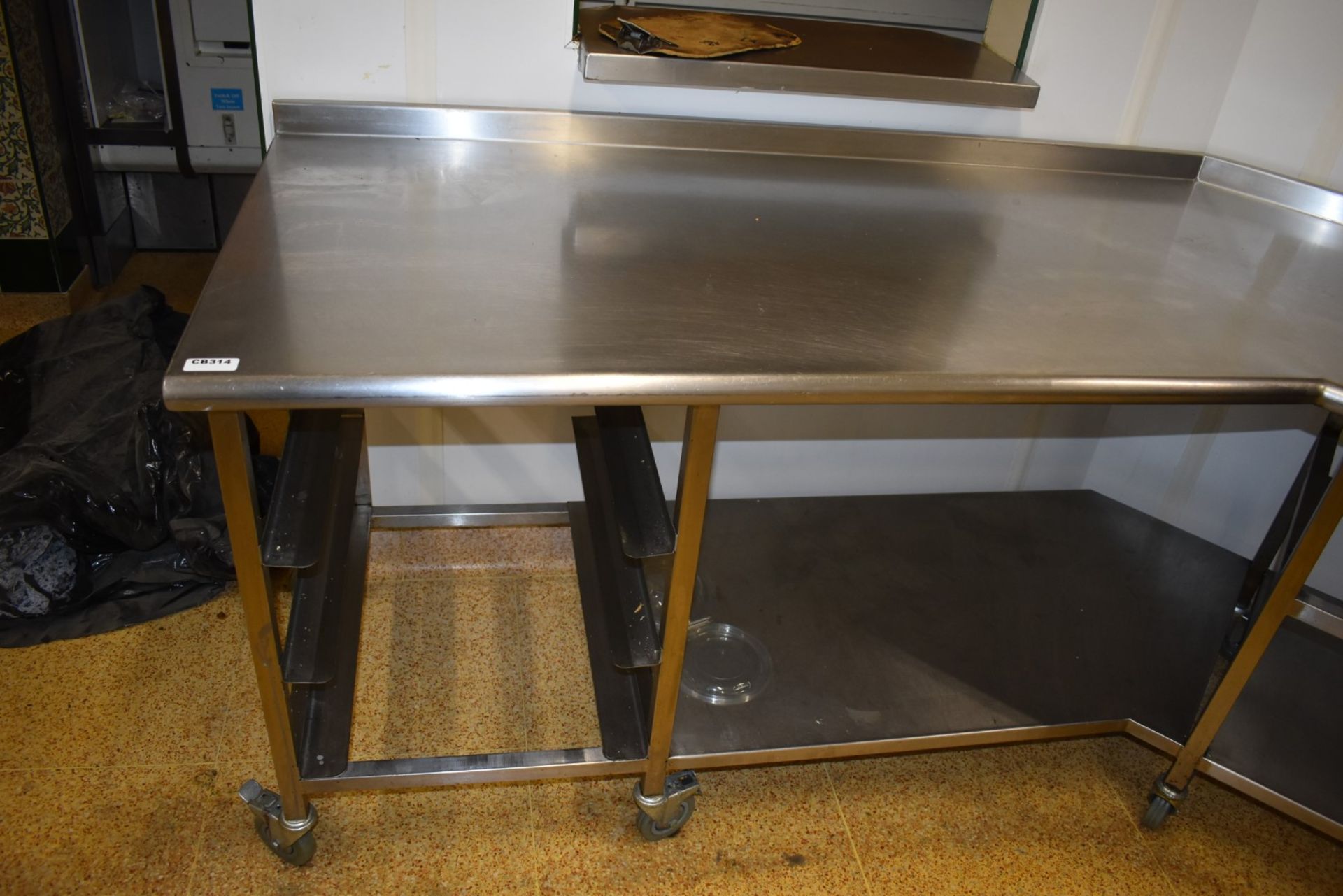 1 x Large Stainless Steel Corner Shaped Prep Table on Castors With Upstand, Undershelf, Tray Rails - Image 3 of 6