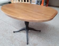 A Pair Of Oval Wood Topped Bistro Tables With Ornate Matal Bases - Taken From A City Centre Bar & Re