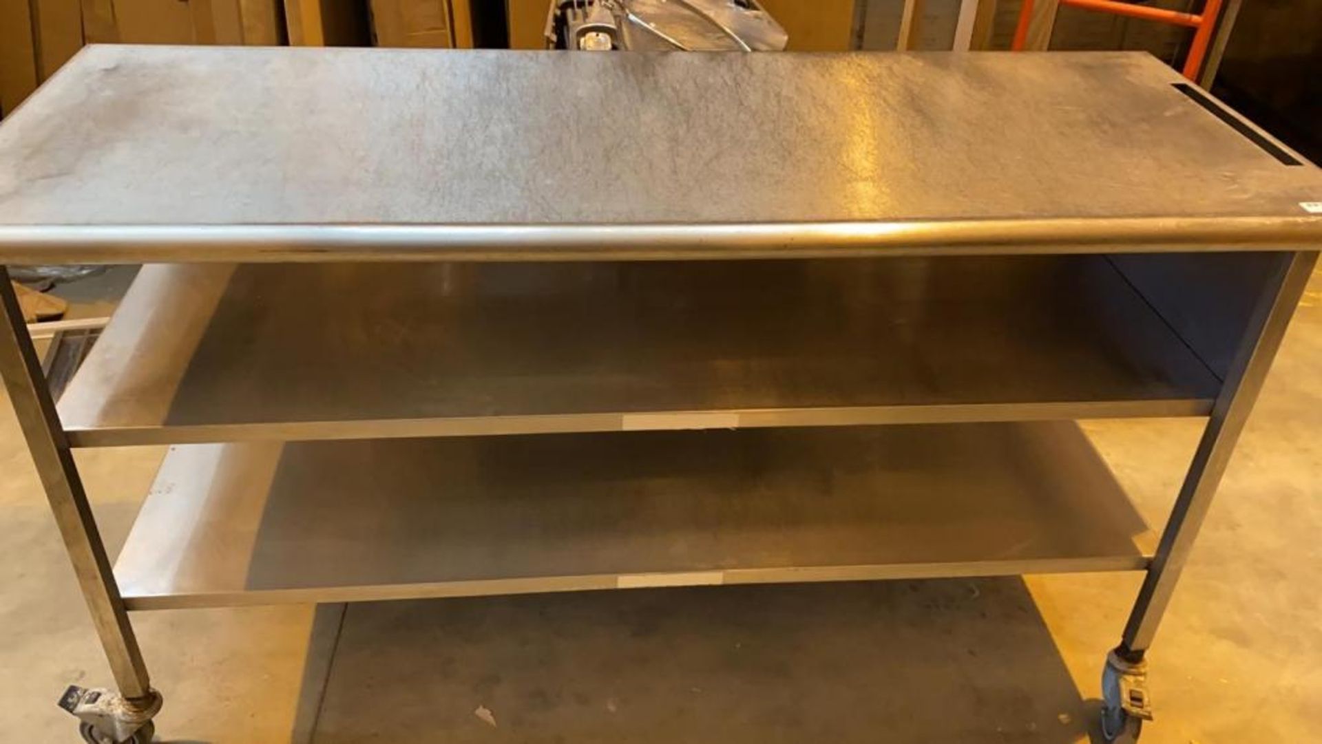 1 x Long Stainless Steel Commercial Kitchen Prep Table on Casters With 2 Undershelves - Dimensions: