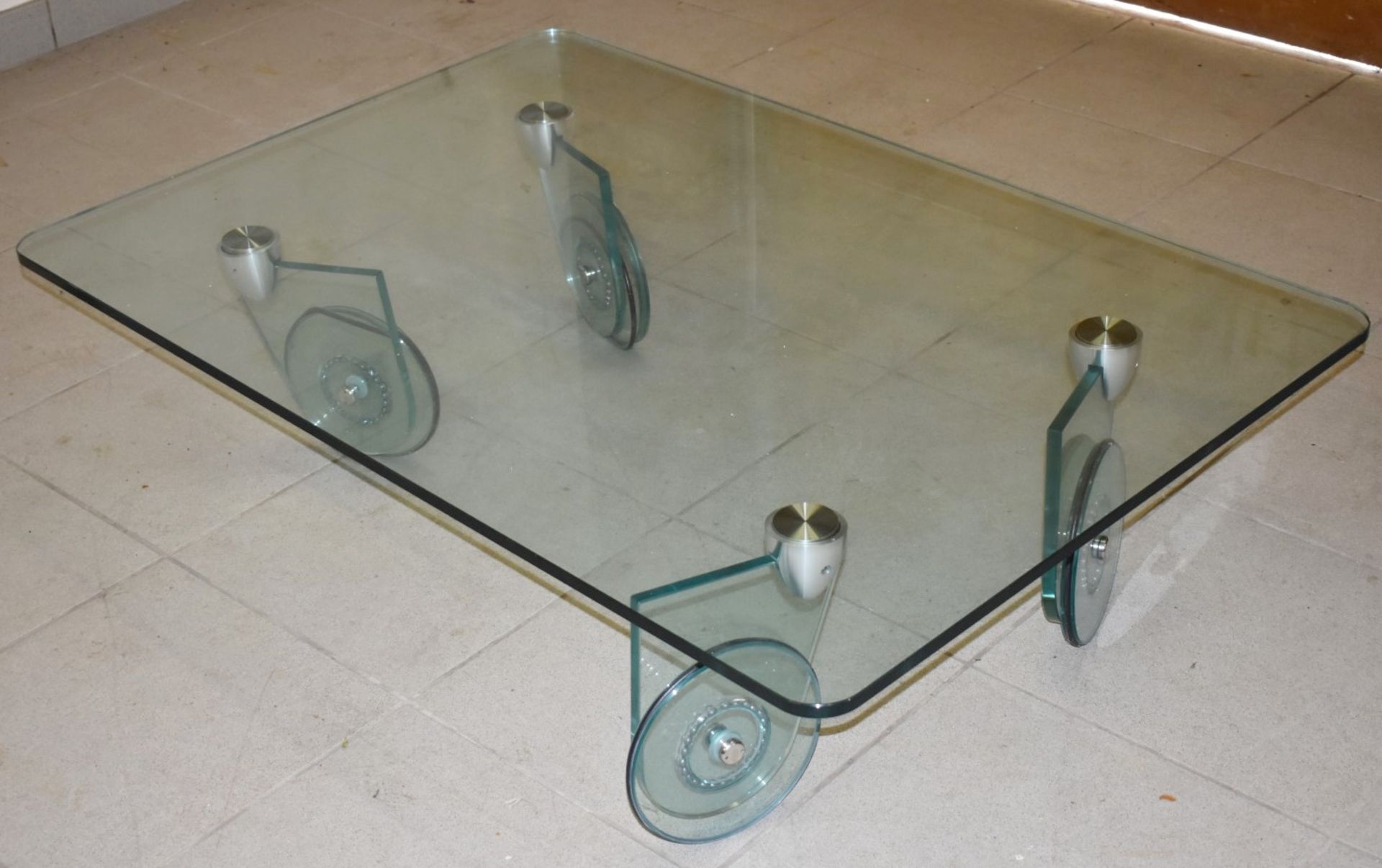 1 x Glass Coffee Table With 2cm Thick Top and Wheel Design Legs - Dimensions: H30 x W125 x D85 cms -