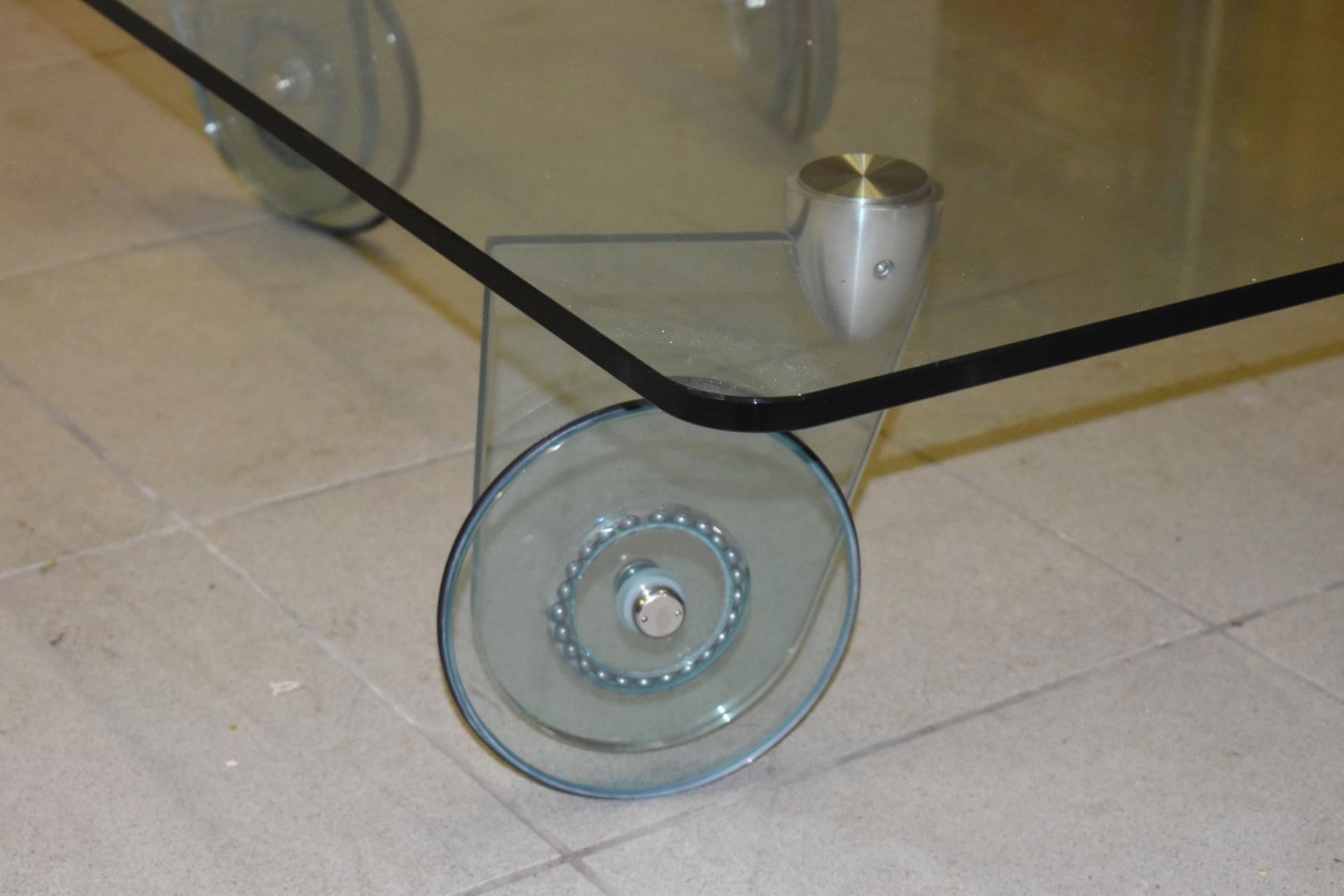 1 x Glass Coffee Table With 2cm Thick Top and Wheel Design Legs - Dimensions: H30 x W125 x D85 cms - - Image 2 of 3