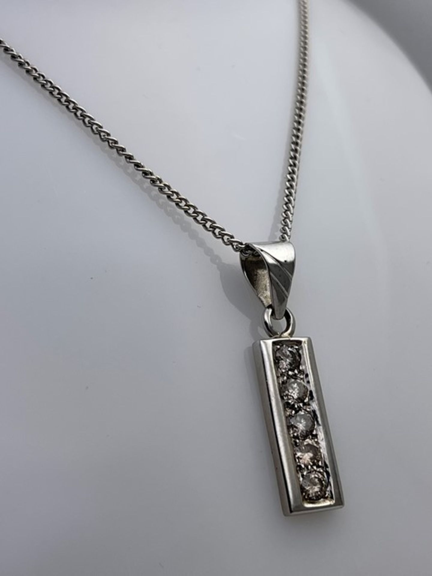 ***£3555.00*** 18CT WHITE GOLD DIAMOND PENDENT, SET WITH FIVE ROUND BRILLIANT CUT DIAMONDS