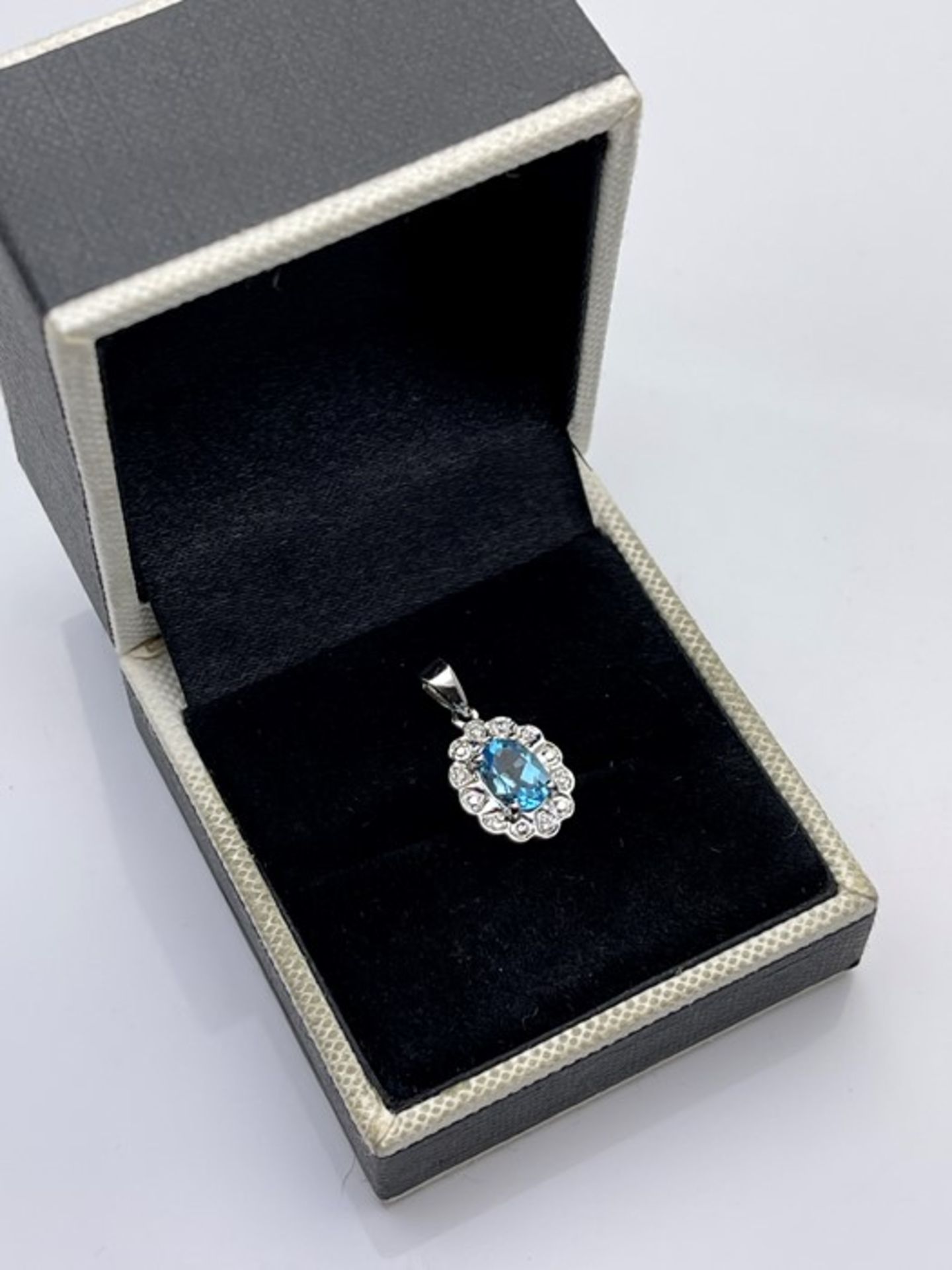 ***£460.00*** 9CT WHITE GOLD LADIES DIAMOND AND TOPAZ PENDENT