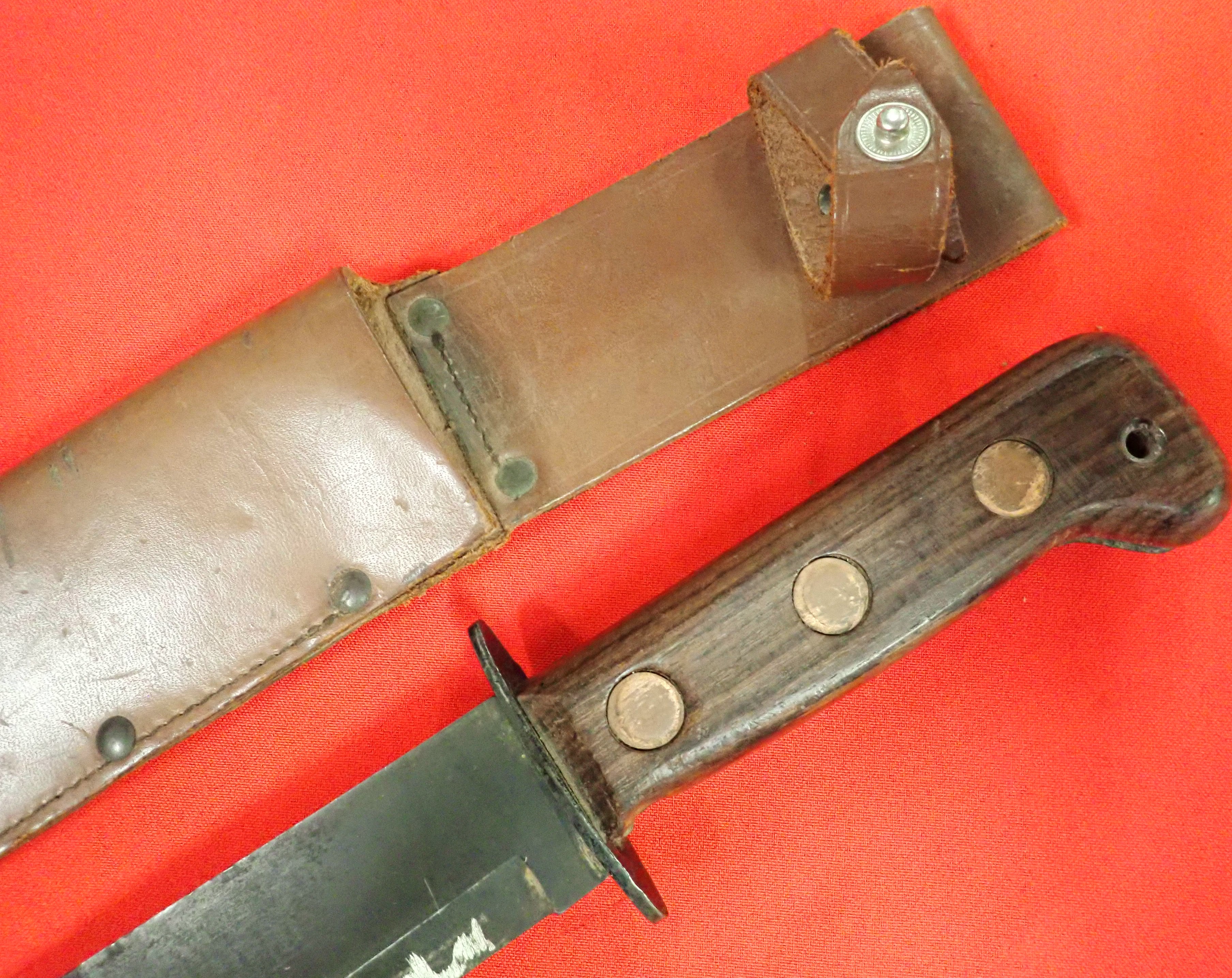 1984 British utility combat knife with MoD numbered scabbard.