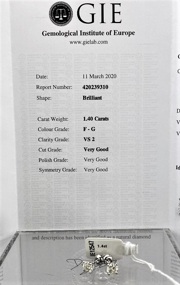 Pair of New 1.40 Carat Round Cut VS2/F Diamond Stud Earrings on 14K White Hallmarked Gold - Image 2 of 5
