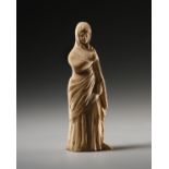A Small Statuette of a Draped Female