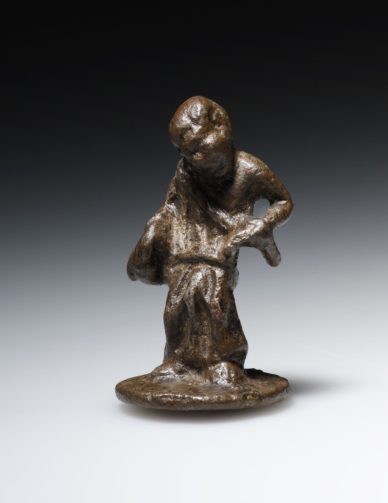A Bronze Statuette of a Beggar