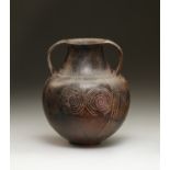 An Etruscan Impasto Amphora with Incised Geometric and Spiral Decoration