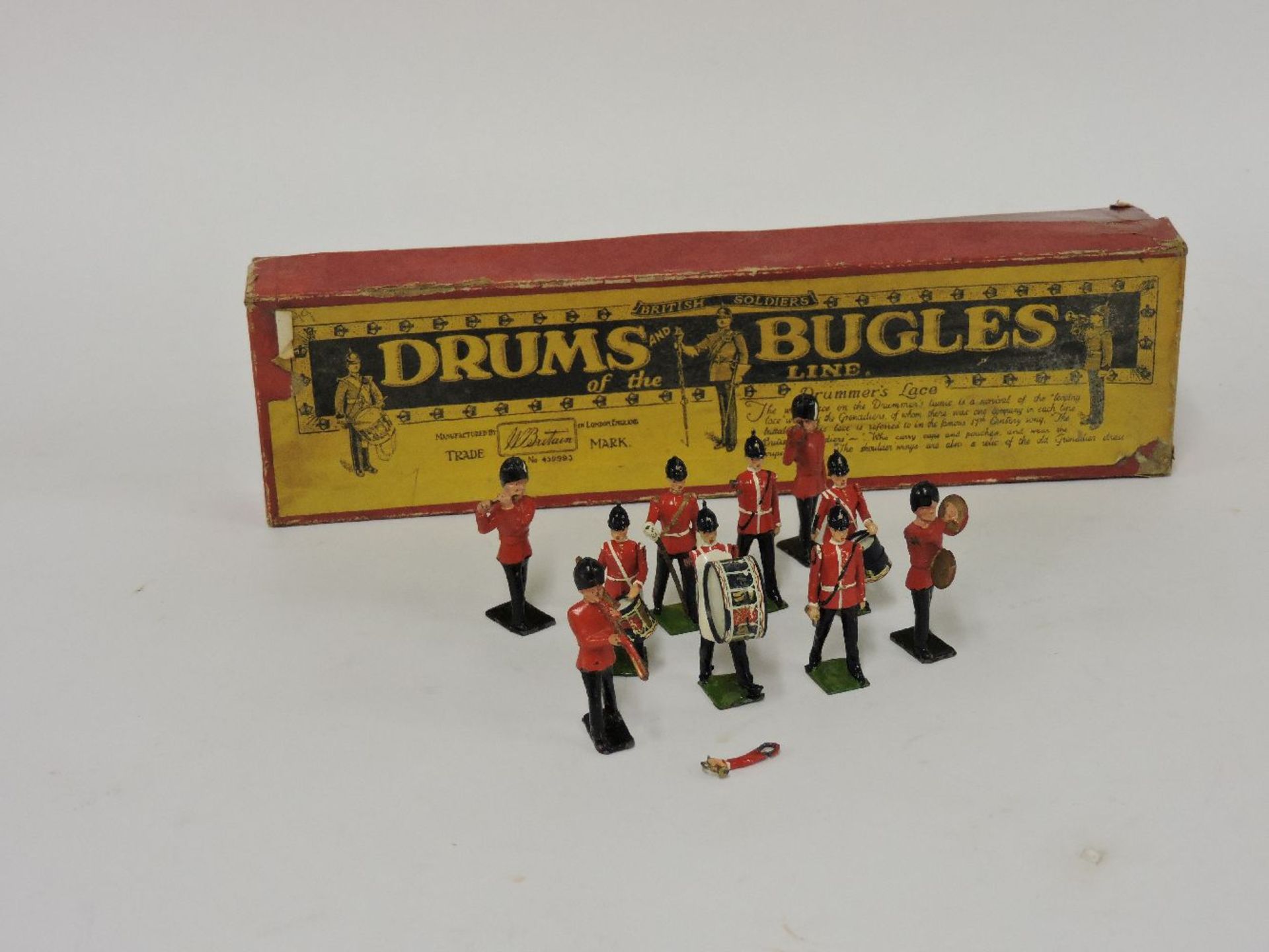 A Britains no 30 'Drums and Bugles of the Line', six figures and four guards bandsmen, worn