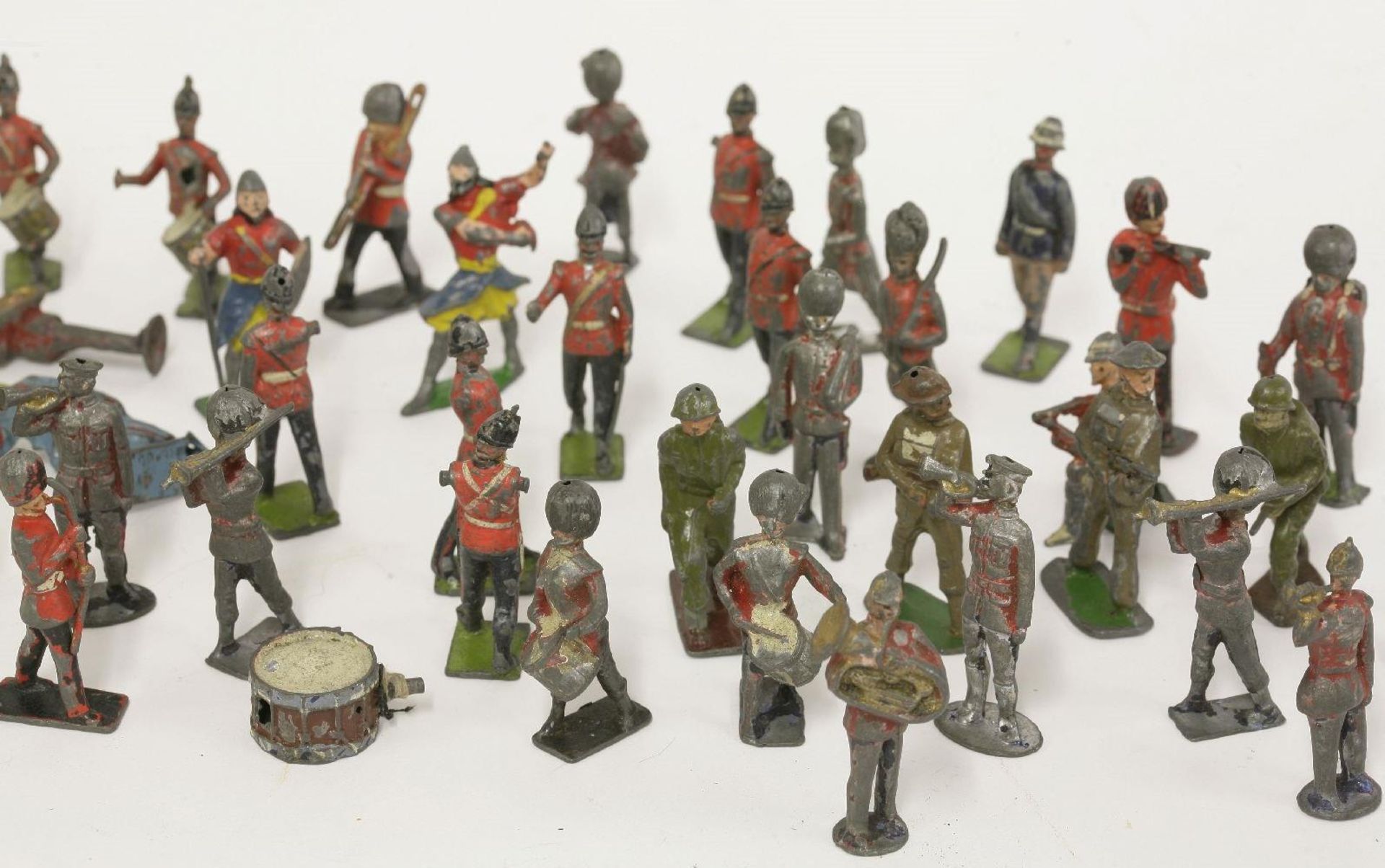 A collection of die cast soldiers, and other figures