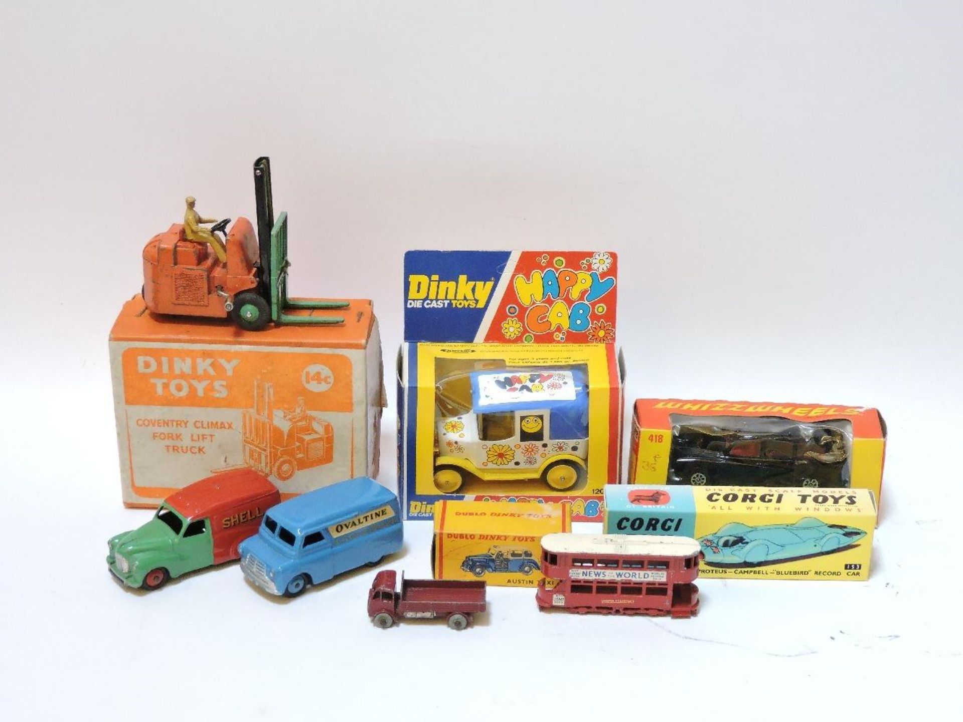 A collection of die cast toys, Dinky Climax Forklift, Dinky Ovaltine van, Dinky BP Austin van,