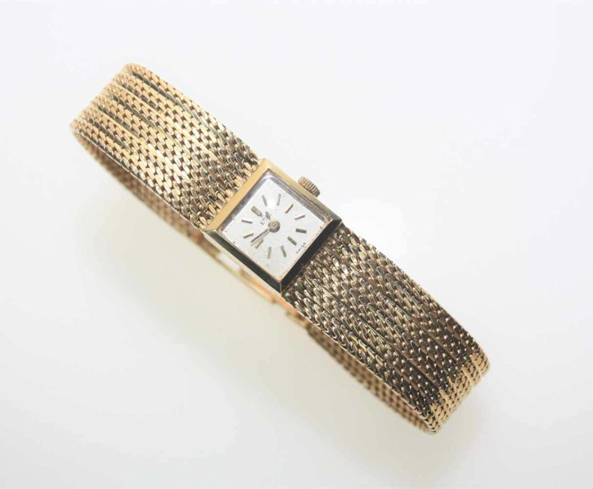 Goldene Damen-Armbanduhr mit fest angearbeitetem Ansatzband 750/f gest., quadratisches Zifferblatt