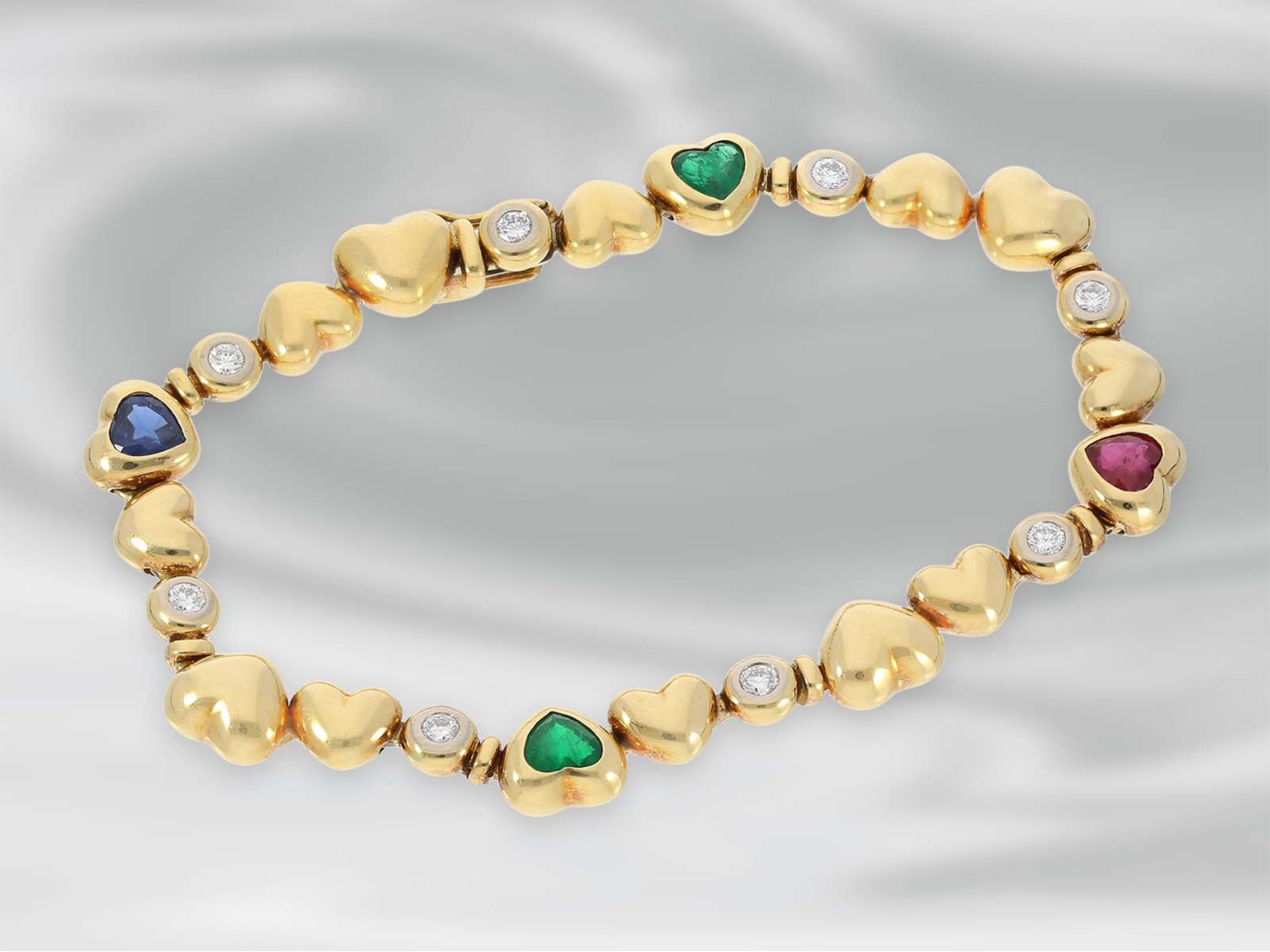 Armband: hochwertiges, modernes goldenes Herzarmband mit Smaragd-, Rubin-, Saphir- und