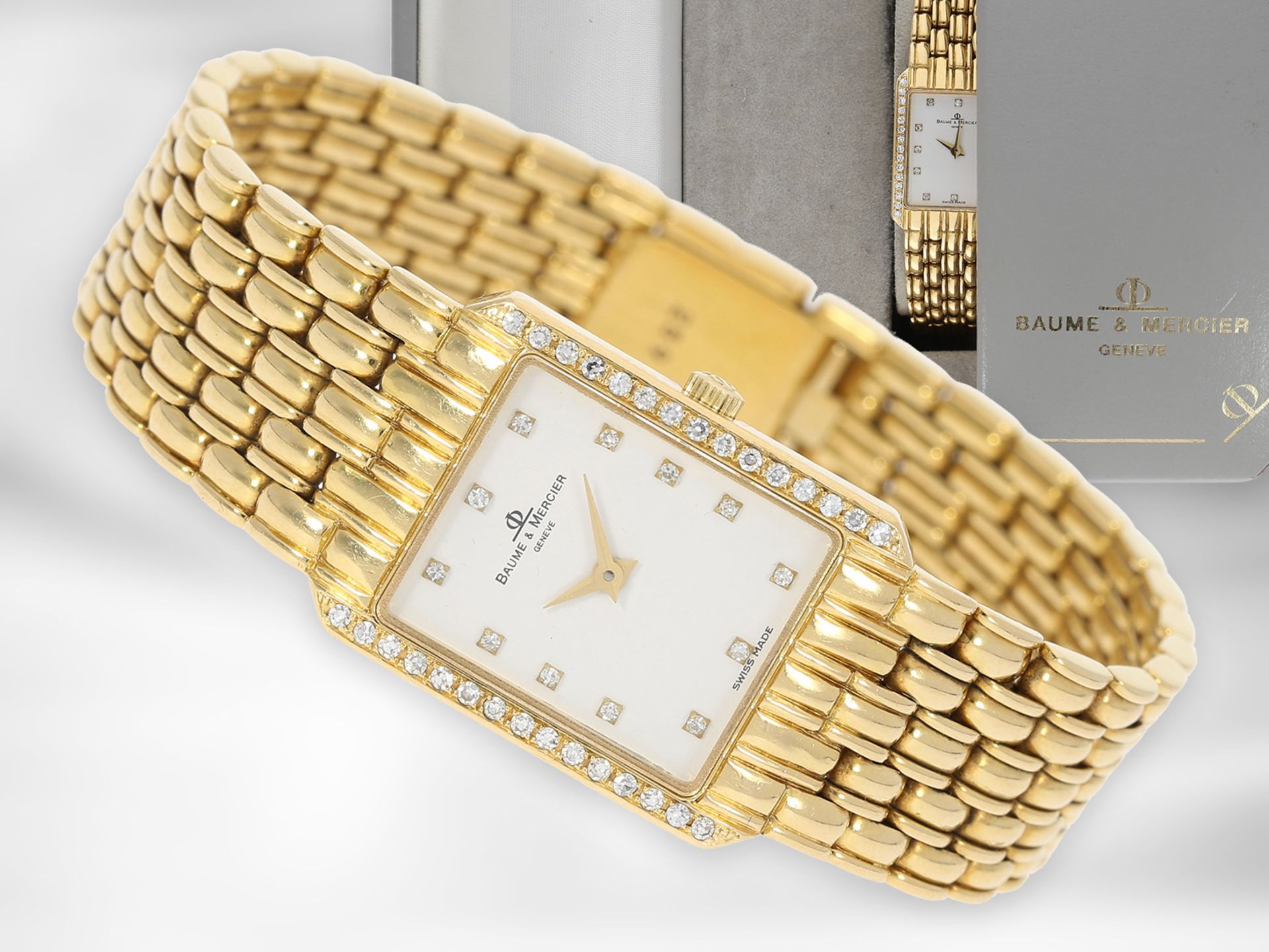Armbanduhr: elegante, goldene vintage Baume & Mercier Damenuhr mit Diamant-Lünette, 18K Gold, mit