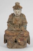 BuddhaChina, 19. Jahrhundert. Holz. Reste von polychromer Bemalung. H. 35,5 cm. Sitzend mit