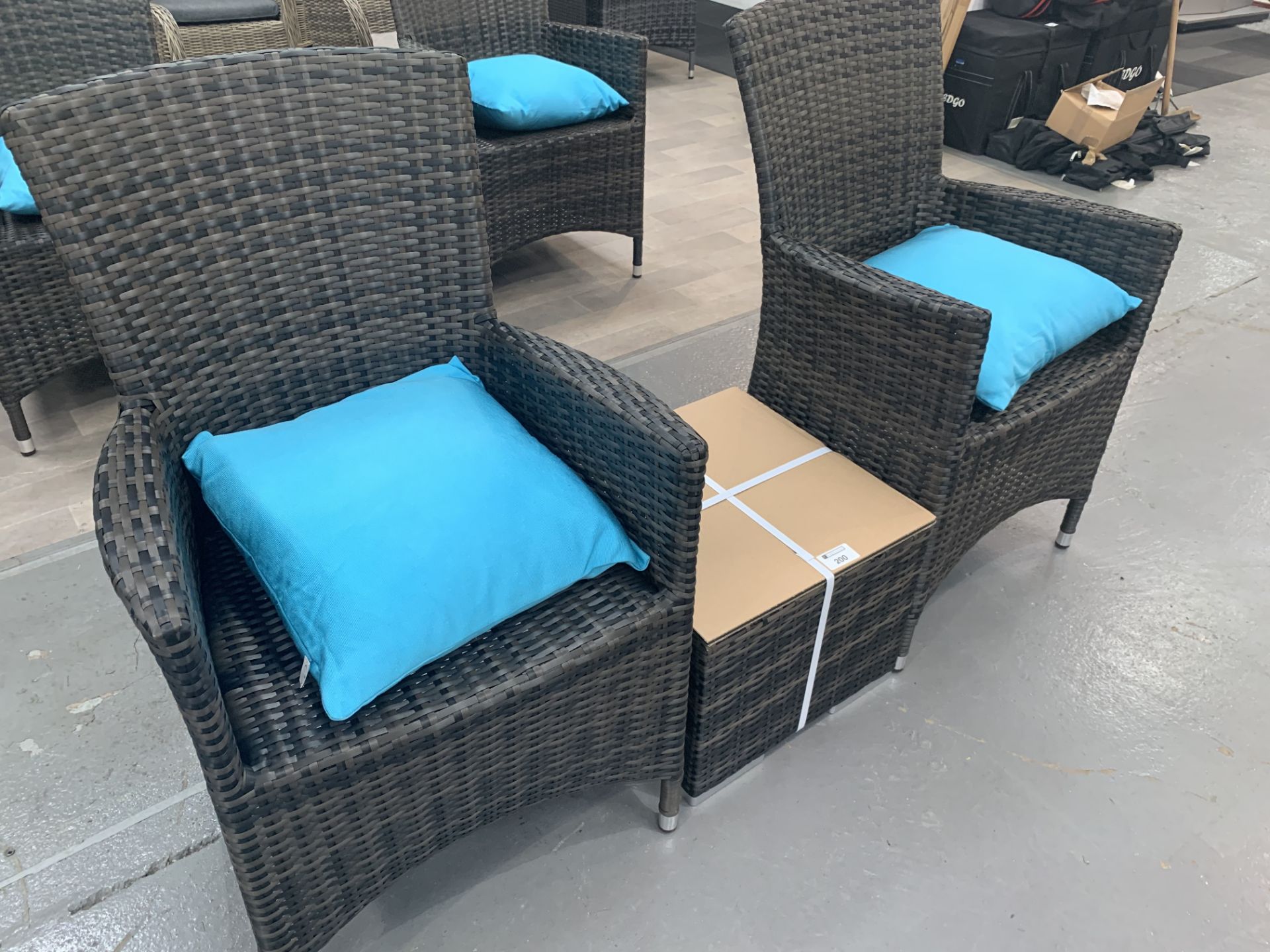 A Pair of Maze Rattan Cushion Arm chairs with matching glass top table - Image 2 of 3