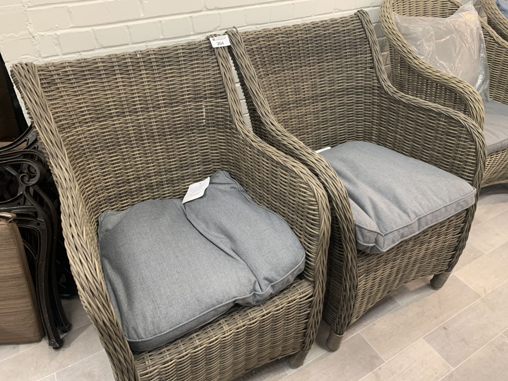 A pair of returned damaged see photo Maze Rattan arm chairs