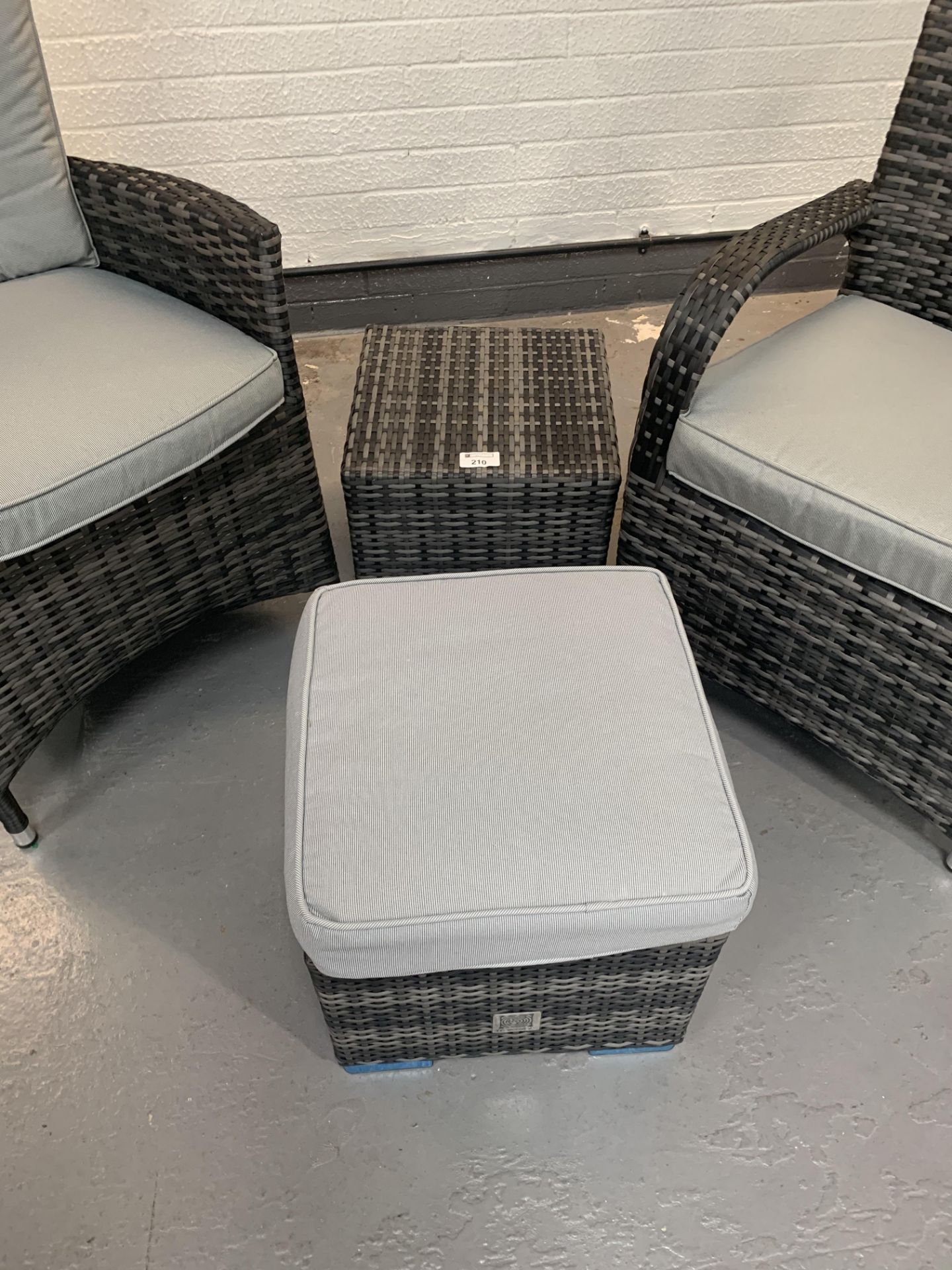 A pair of Grey Maze Rattan arm chairs 1 missing back cushion and 2 footstools - only 1 x cushion - Image 2 of 4