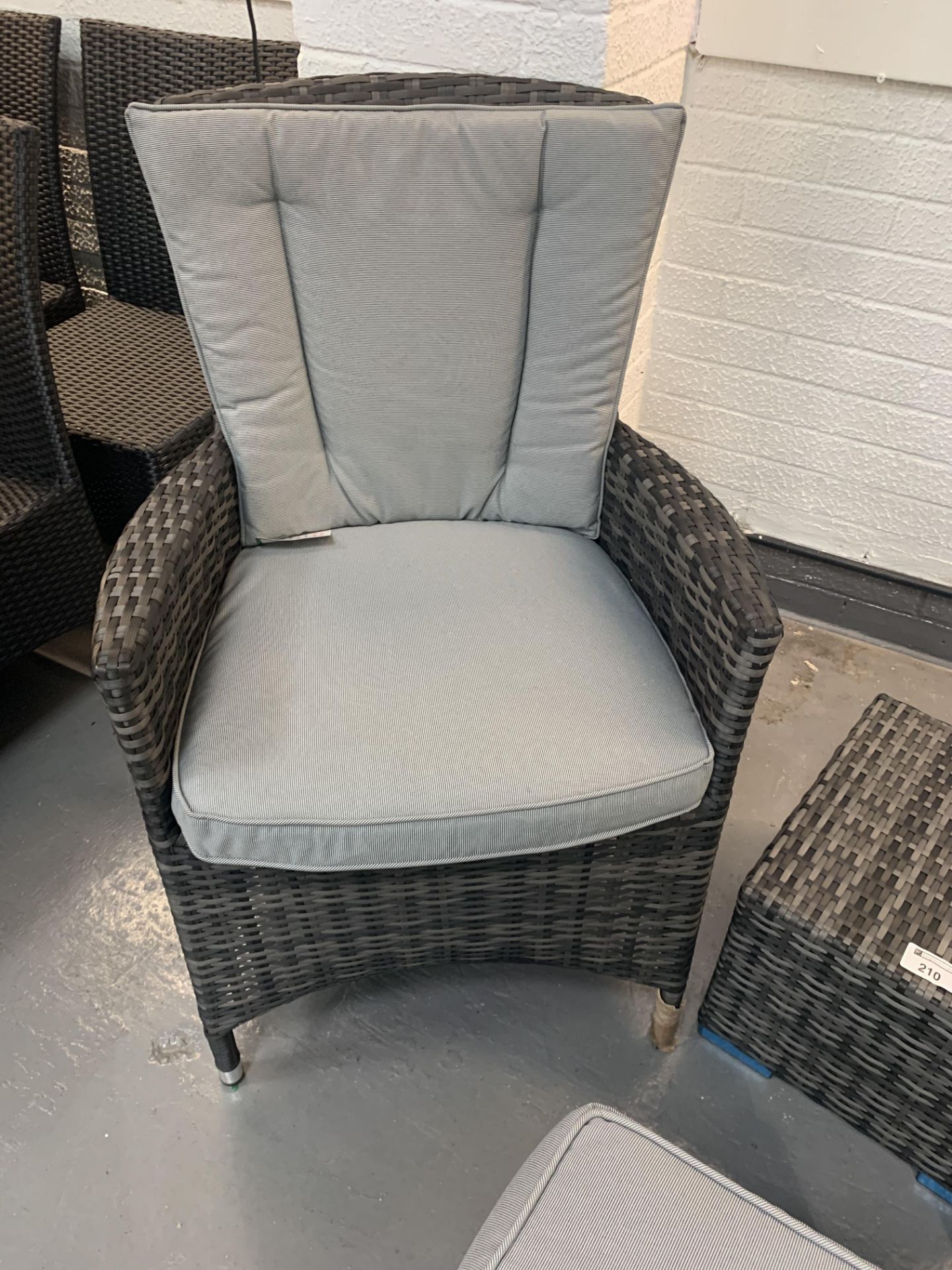 A pair of Grey Maze Rattan arm chairs 1 missing back cushion and 2 footstools - only 1 x cushion - Image 4 of 4