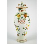 A Chinese relief moulded florally encrusted vase, Qianlong