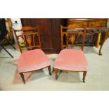 A pair of Edwardian nursing chairs with marquetry