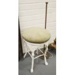 A painted metal stool, with cast fern decoration.