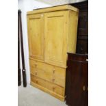 A pine linen press fitted two doors above two shor
