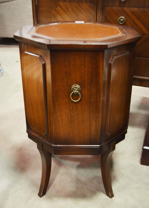 A reproduction mahogany cellarette on splayed supp