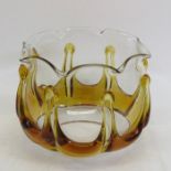 A amber trailed glass light shade, crimped rim