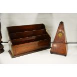 A mahogany and brass inlaid tiered letter rack and