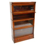 A four tier walnut Globe Wernicke bookcase