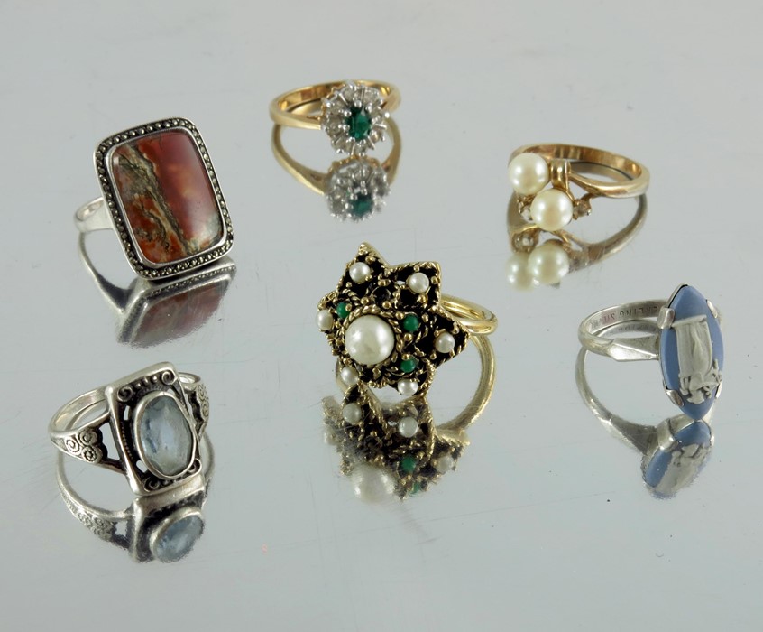 A collection of rings including 18 carat gold and white stone ring