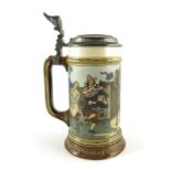 Fritz Quidenus for Mettlach, Villeroy and Boch, a litre stein, incised tavern scene with jester on a