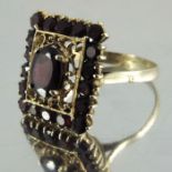 A 9 carat gold and garnet ring