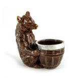A Doulton Lambeth stoneware silver plate mounted condiment piece, modelled as a seated bear with a b