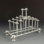 An Aesthetic Movement silver plated six division toast rack