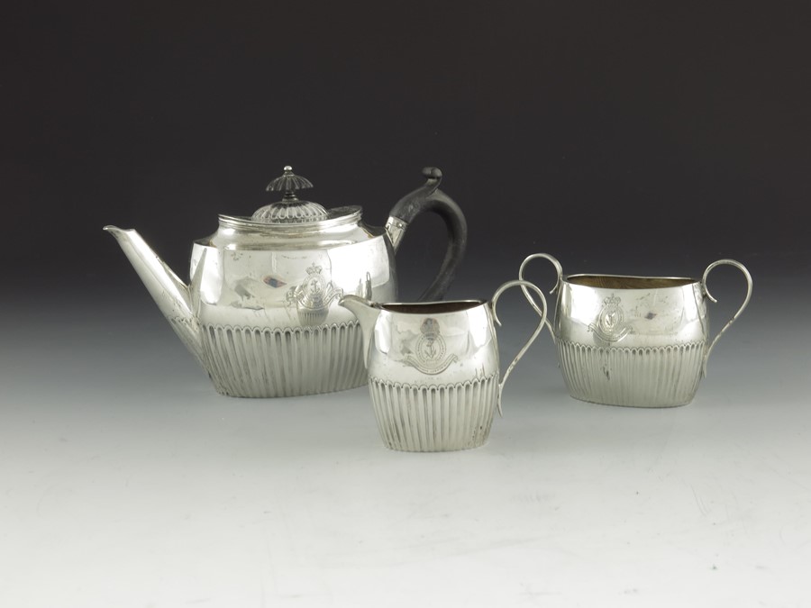 A Victorian silver bachelors three piece tea set, William Hutton and Sons