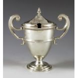 Robert Pringle, Chester 1909, an Edwardian silver mustard pot, twin handled trophy form, footed and