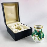 A Moorcroft miniature enamelled vase, Holly and Mistletoe