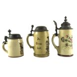 Three steins including a Mettlach, Villeroy and Boch relief moulded half litre