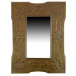 An Arts and Crafts copper mirror, in the Keswick style